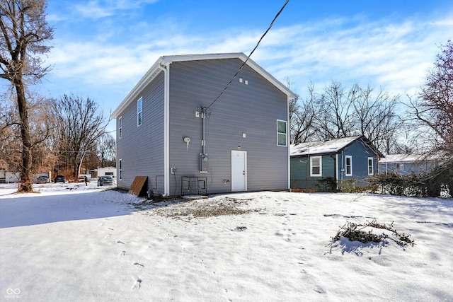 view of snow covered house