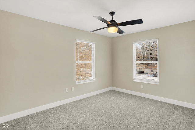 spare room featuring carpet floors and ceiling fan