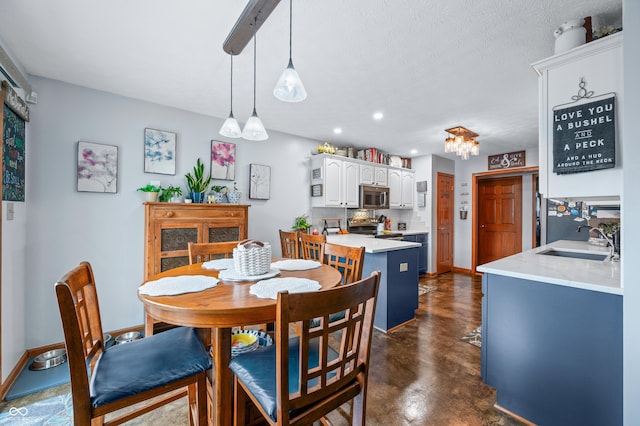 dining space featuring sink