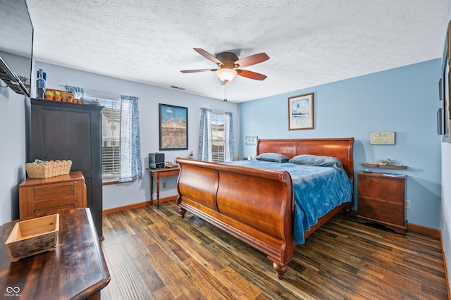 bedroom featuring ceiling fan, a textured ceiling, and dark hardwood / wood-style flooring