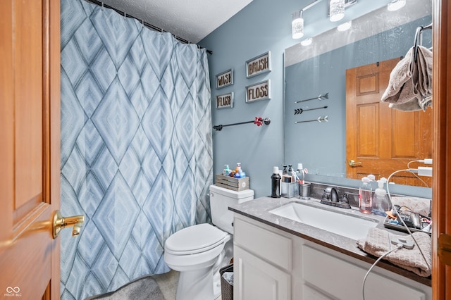 bathroom featuring vanity, toilet, and a shower with curtain