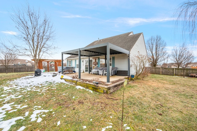 back of house with a pergola, a yard, a patio area, and a hot tub