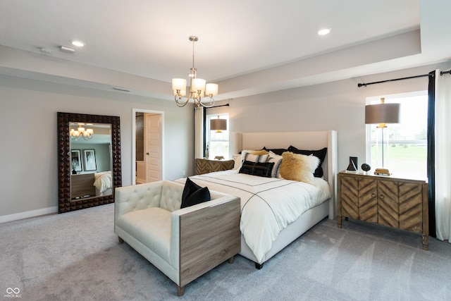 carpeted bedroom with a chandelier