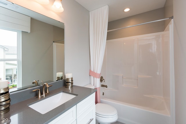 full bathroom with vanity, bathtub / shower combination, and toilet