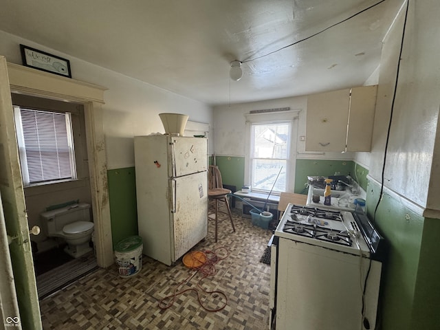 kitchen featuring white appliances and sink