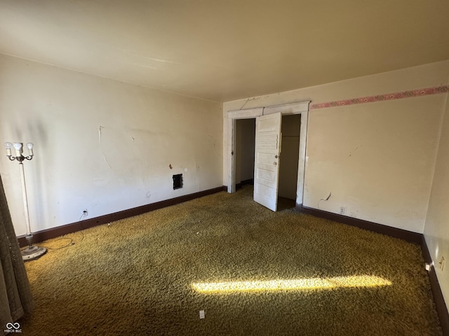 unfurnished bedroom featuring dark colored carpet