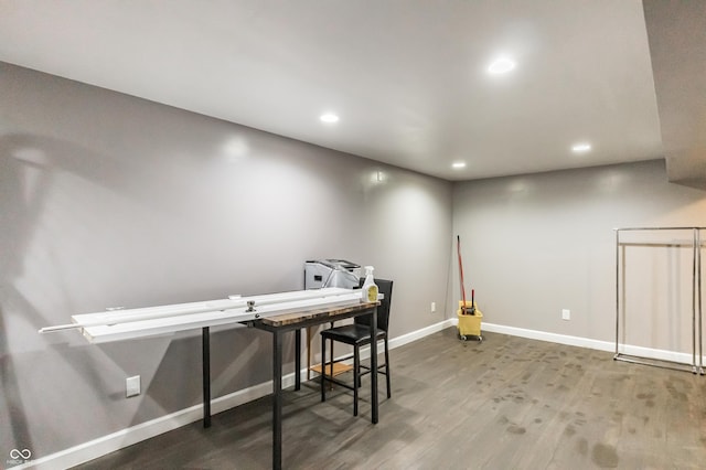 home office with wood-type flooring