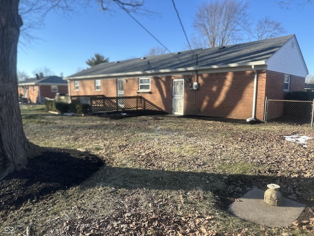 back of house with a wooden deck