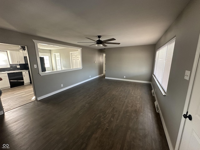 unfurnished living room featuring hardwood / wood-style flooring, ceiling fan, and a healthy amount of sunlight