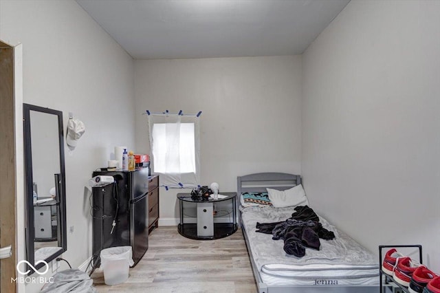 bedroom with light hardwood / wood-style flooring