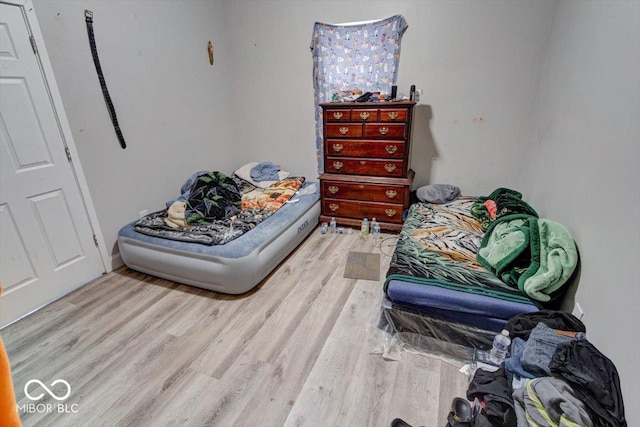 bedroom with light wood-type flooring