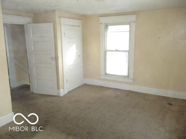 unfurnished bedroom featuring carpet floors