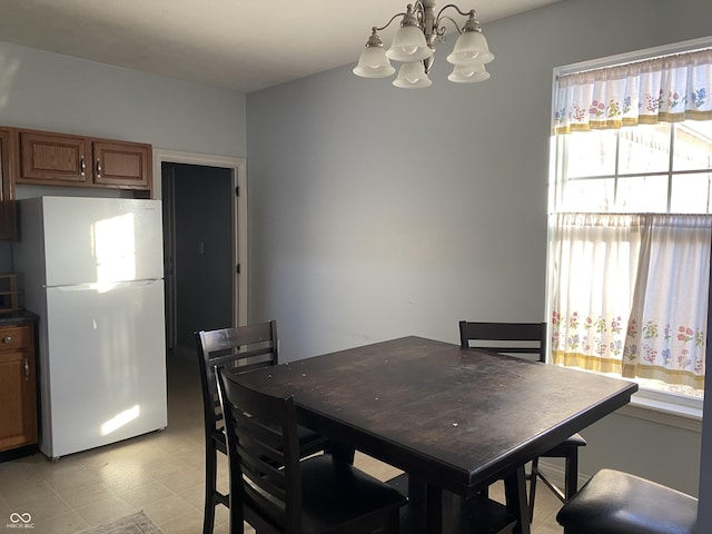 dining area with a notable chandelier