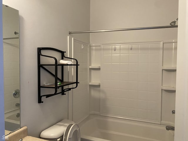 bathroom featuring bathing tub / shower combination and toilet