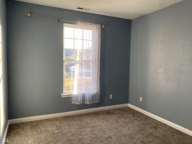 spare room featuring carpet flooring