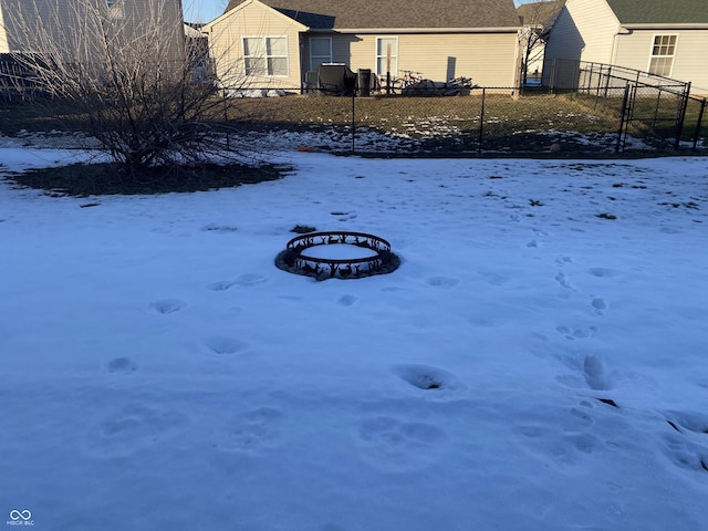 snowy yard with a fire pit