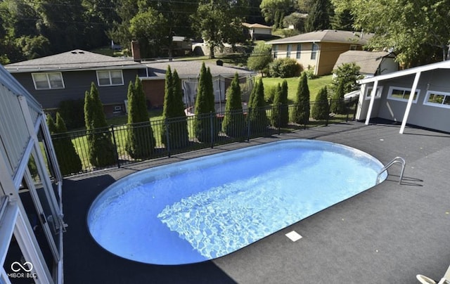 view of swimming pool with a patio area