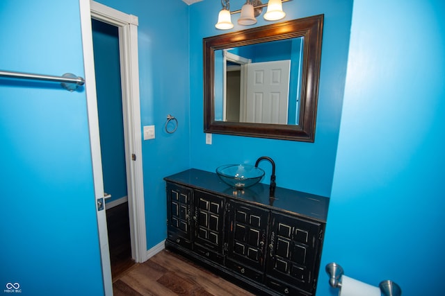 bathroom with hardwood / wood-style flooring and vanity