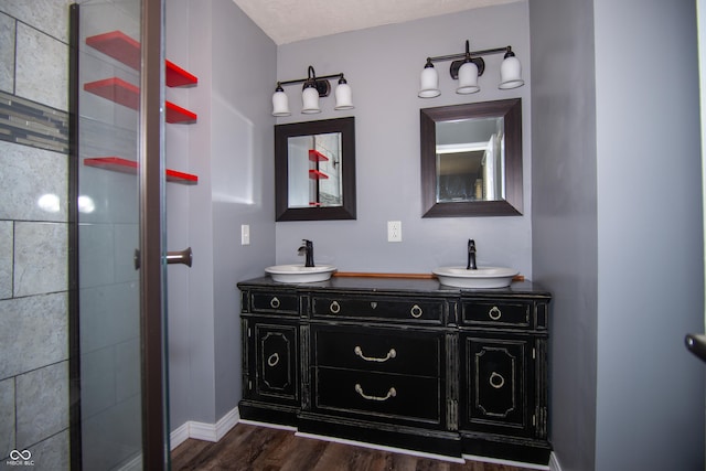 bathroom with vanity and hardwood / wood-style flooring