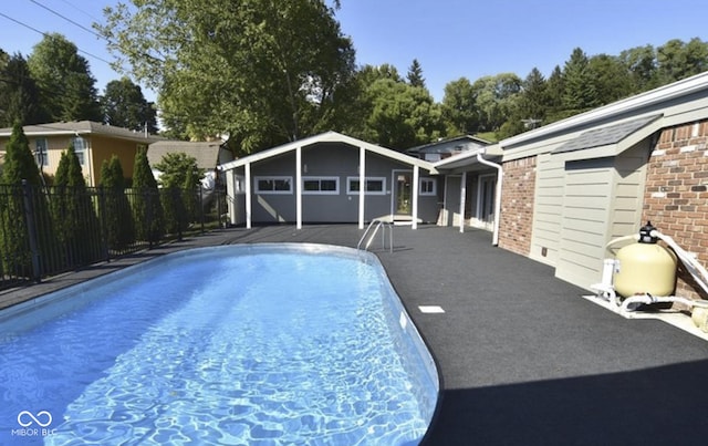 view of swimming pool featuring an outdoor structure