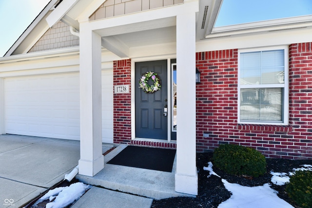 entrance to property featuring a garage