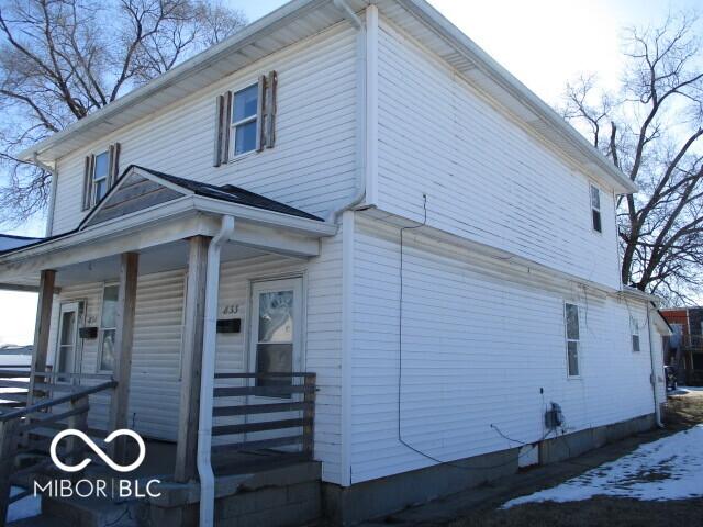 view of property exterior featuring a porch