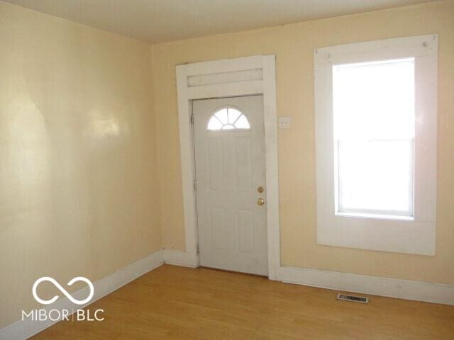 foyer with light wood-type flooring