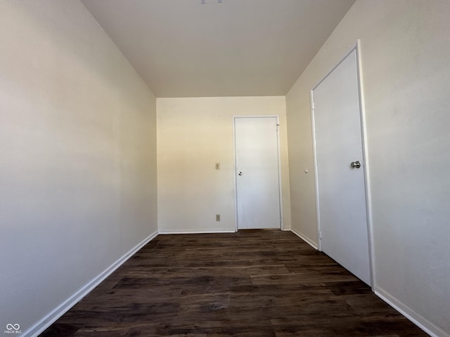 hall with dark hardwood / wood-style floors