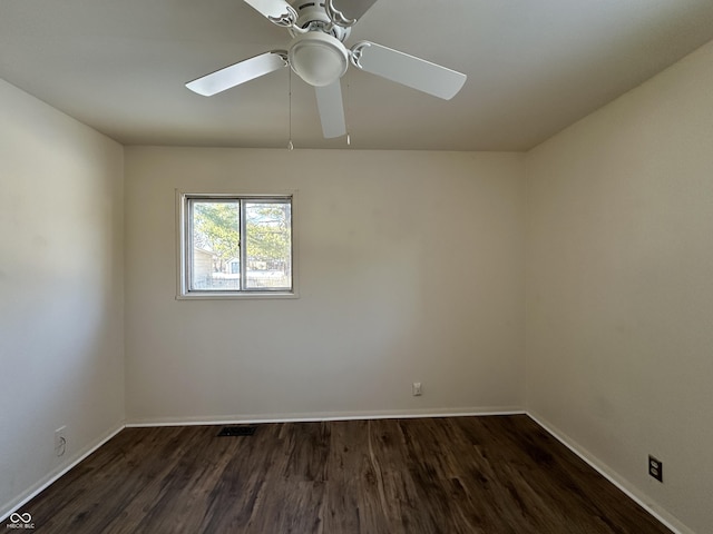 unfurnished room featuring dark hardwood / wood-style floors and ceiling fan