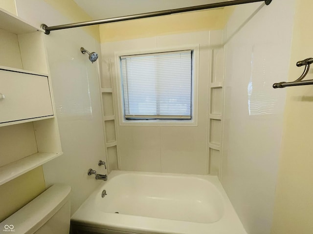 bathroom with shower / tub combination and toilet