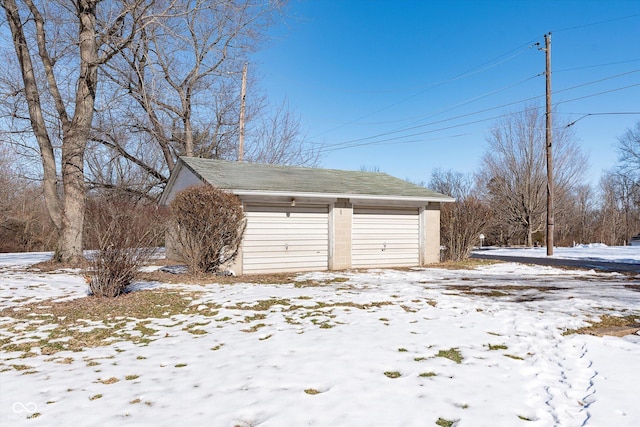 view of snow covered garage