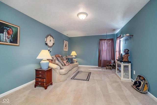 living room with light colored carpet and a textured ceiling