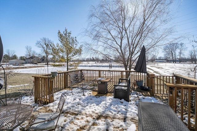 view of snow covered deck