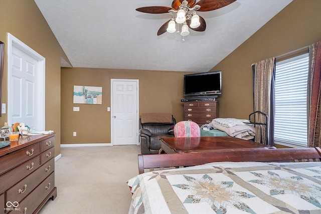 carpeted bedroom with lofted ceiling and ceiling fan