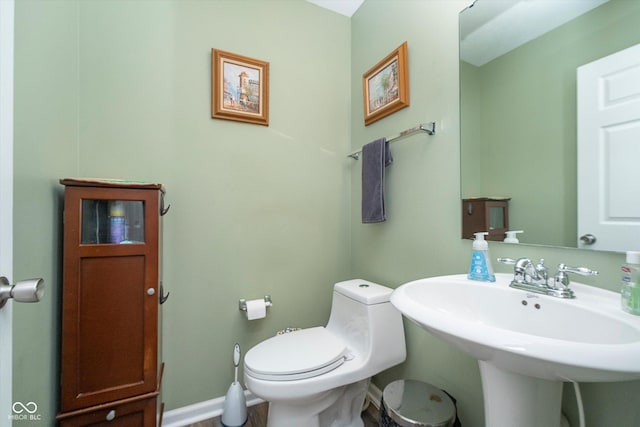 bathroom featuring sink and toilet