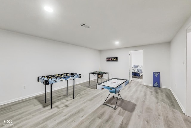 recreation room featuring light wood-type flooring