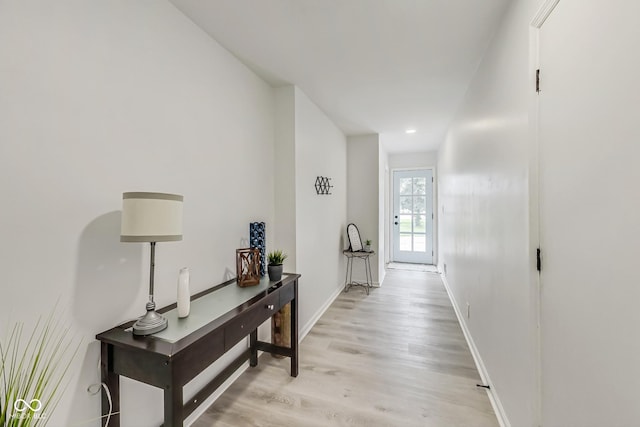 corridor featuring light hardwood / wood-style flooring