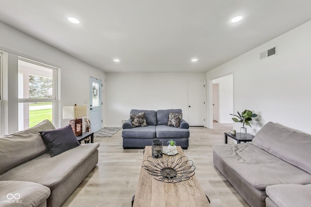 living room with light hardwood / wood-style floors