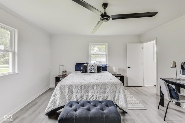 bedroom featuring ornamental molding, ceiling fan, and light hardwood / wood-style flooring