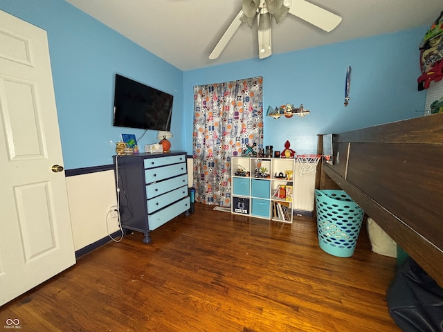 bedroom with dark wood-type flooring and ceiling fan