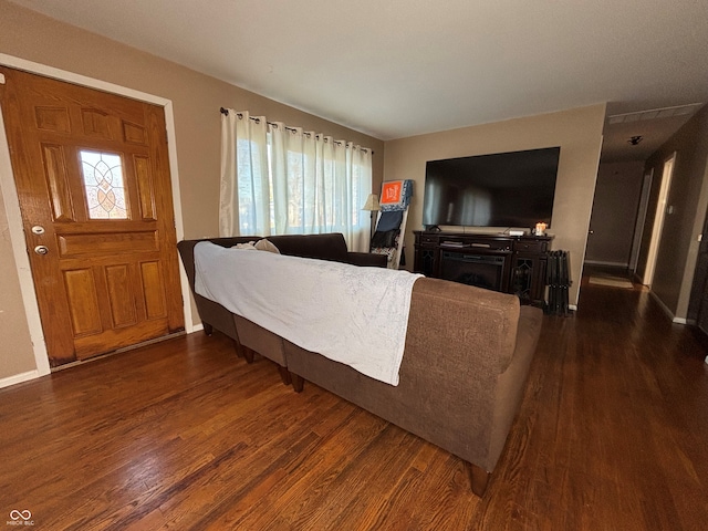 living room with dark hardwood / wood-style floors