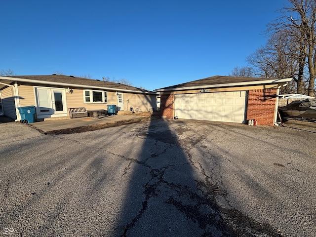 single story home with a garage