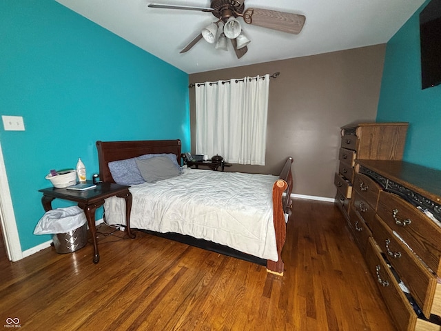 bedroom with ceiling fan and dark hardwood / wood-style flooring