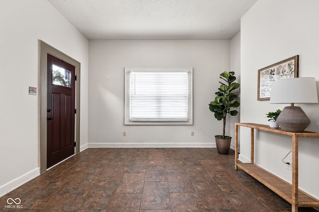 foyer featuring a textured ceiling