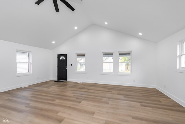 unfurnished living room featuring ceiling fan, high vaulted ceiling, and light hardwood / wood-style floors