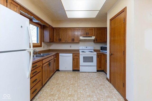 kitchen with sink and white appliances