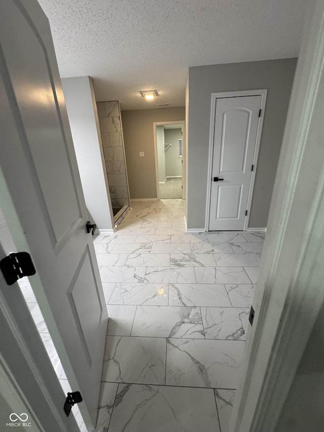 bathroom with a textured ceiling