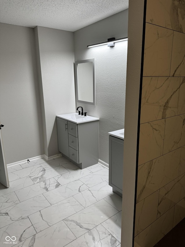 bathroom featuring vanity and a textured ceiling