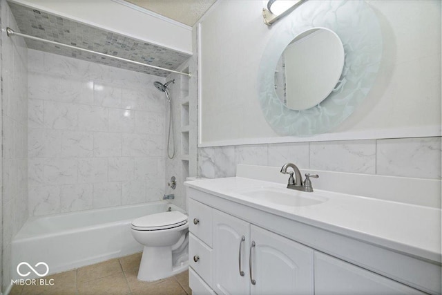 full bathroom with tile walls, tiled shower / bath combo, vanity, tile patterned floors, and toilet