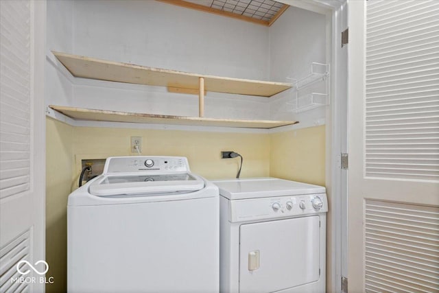 laundry area featuring washing machine and clothes dryer